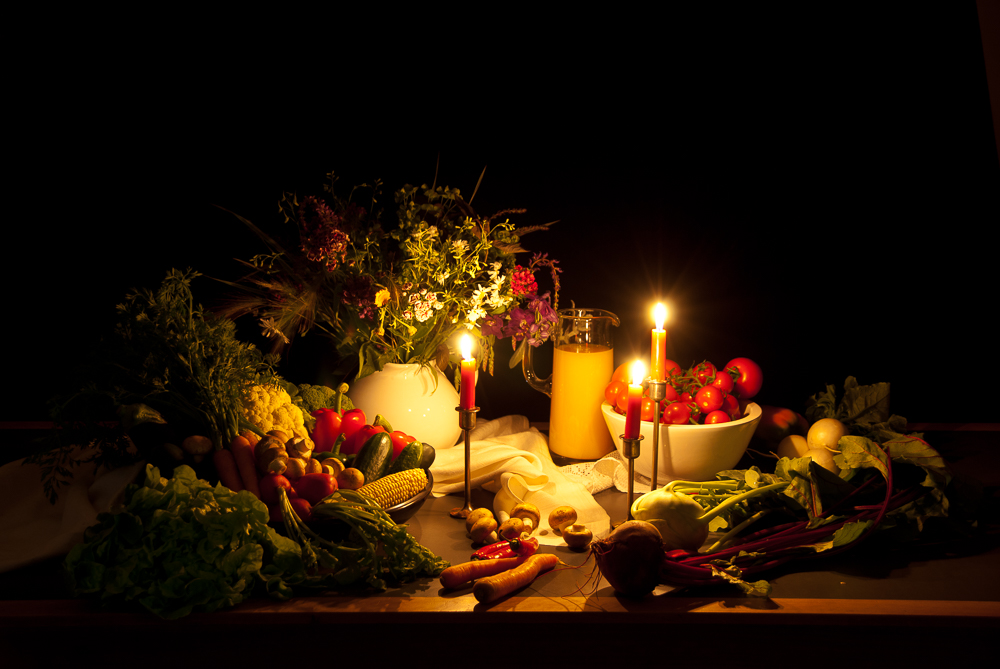 a still life photography (vegetables in candlelight)