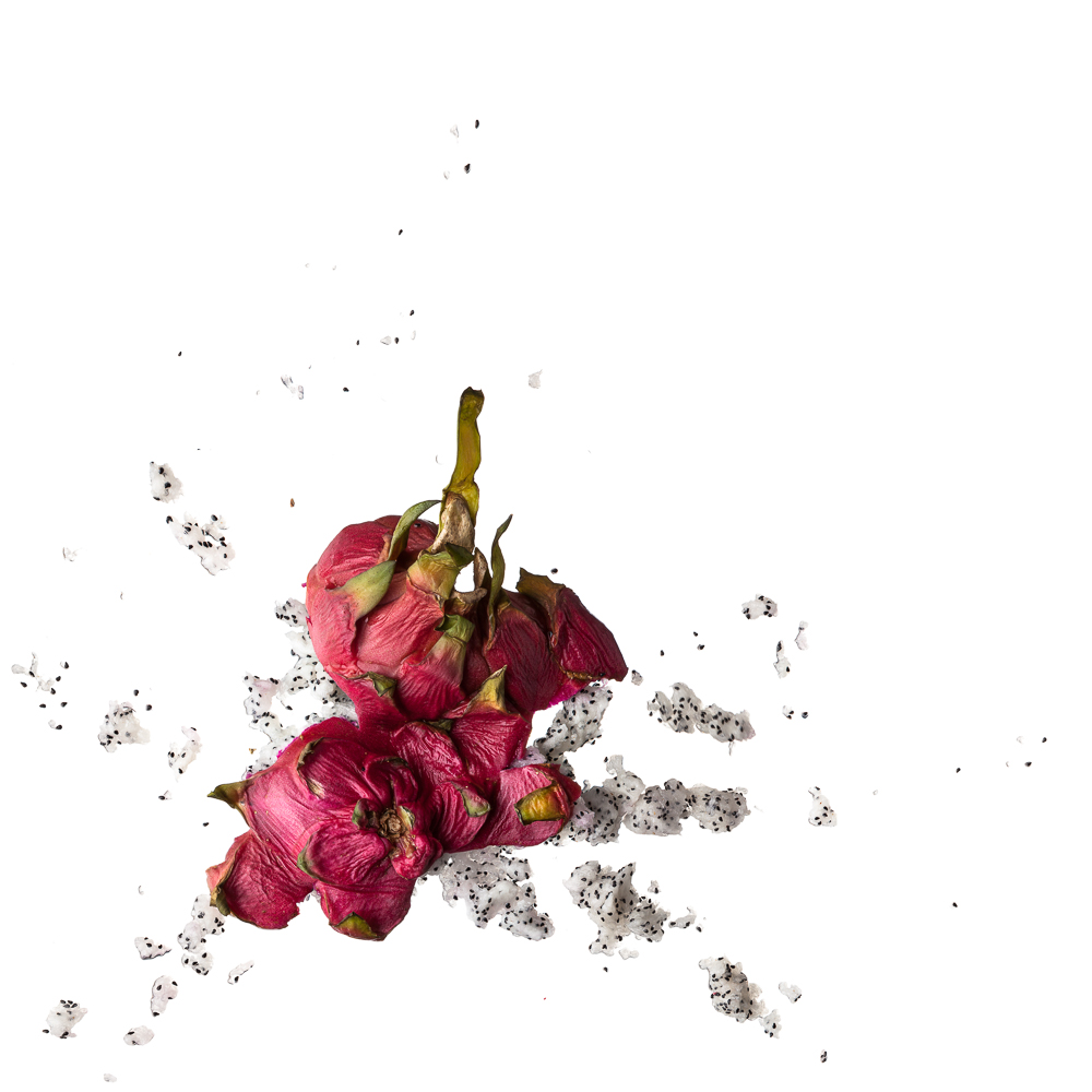 a minimalistic picture aesthetically showing a smashed dragonfruit on pure white ground (no shadow)