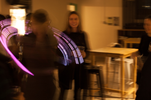 someone dancing in a bar with the device